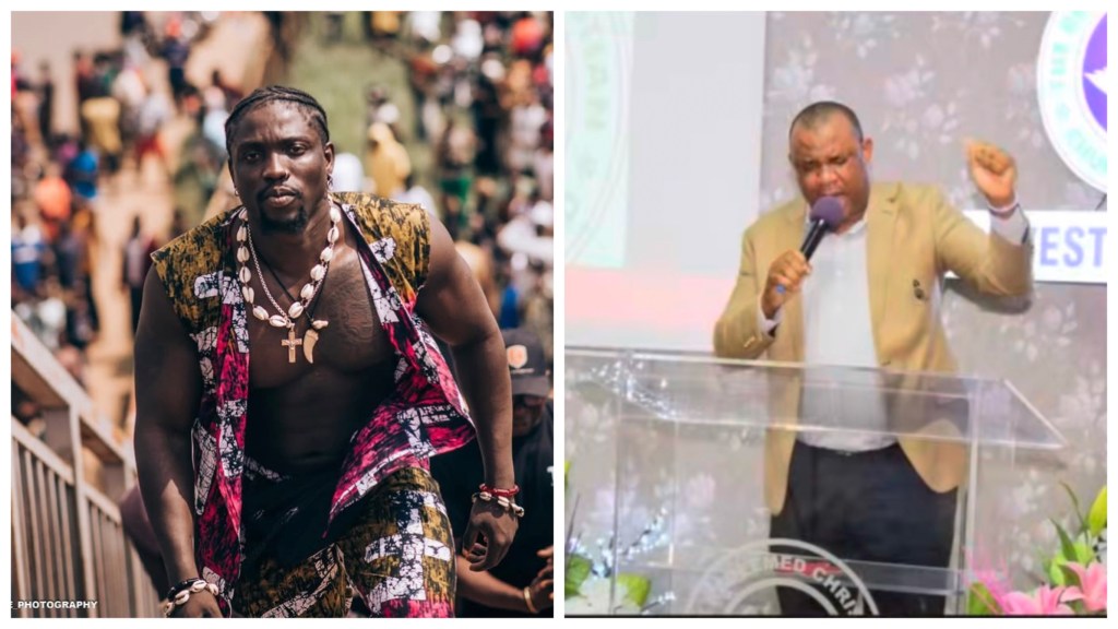 Verydarkman in a sleeveless patterned Ankara set with cowrie-shell necklaces and a cross, RCCG pastor in a tan blazer speaking into a microphone behind a clear church lectern, one fist raised, RCCG emblem visible and flowers in front