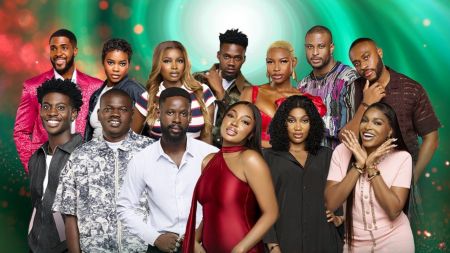 BBNaija Season 10 housemates nominated for possible eviction in week 8, posing together in a group photo with a green and red-themed background.