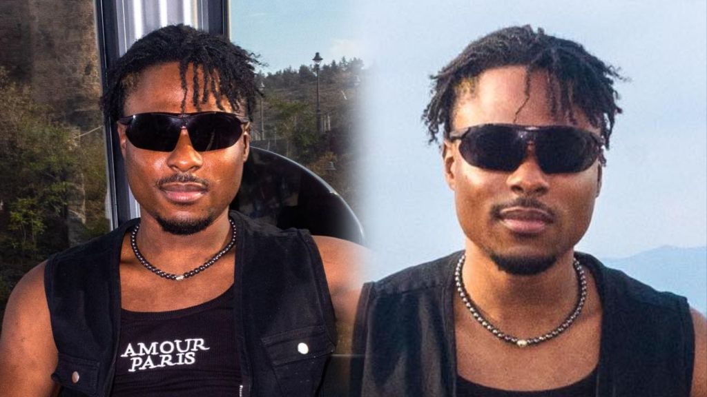 BBNaija Faith poses outdoors wearing black sunglasses, a sleeveless vest, and a beaded necklace.