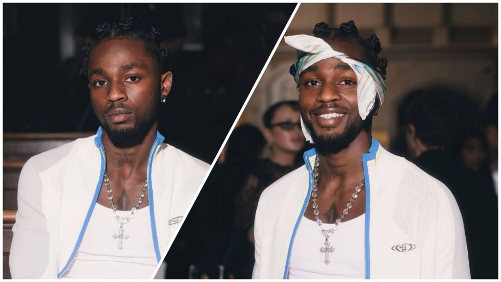 A collage featuring Nigerian Afrobeats singer Omah Lay in two stylish moments. On the left, he poses indoors wearing a white zip-up jacket with blue accents, a white vest, and a silver cross necklace, giving a calm expression. On the right, he smiles brightly while wearing the same outfit with a patterned bandana tied around his head at an event.