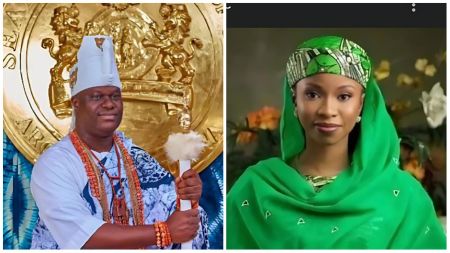 The Ooni of Ife dressed in traditional Yoruba royal attire with a white beaded crown and staff, standing beside a woman in a green headscarf and dress, posing gracefully against a floral background.