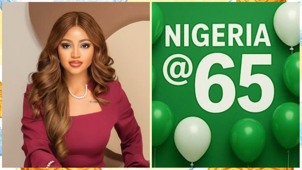 Nigerian actress Regina Daniels in a maroon dress with loose curls, posing beside a green banner that reads "Nigeria @ 65" decorated with balloons