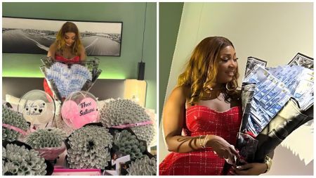 BBNaija star Sultana beams as she poses with a large bouquet made of cash notes, surrounded by several money bouquets and gift boxes inscribed with messages like “We Love You Sultana” and “Thee Sultana.” She stuns in a red strapless gown while admiring the thoughtful gifts arranged beautifully on a table.
