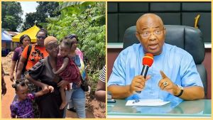 Governor Hope Uzodimma addresses reporters during a press briefing while the rescued widow, Mrs. Chika Ndubuisi, stands outside with her two young children and other women after the alleged widowhood ritual incident in Awo-Omamma, Imo State.