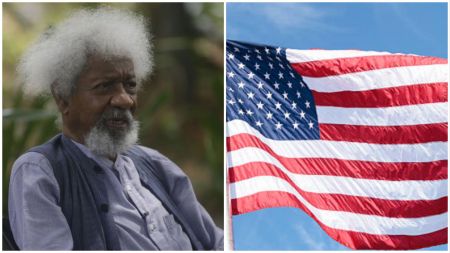 Nigerian Nobel laureate Wole Soyinka seated outdoors beside a close-up of the United States flag waving against a blue sky.