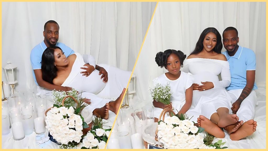 Singer 9ice poses in a white-themed maternity shoot with his pregnant partner and their daughter, surrounded by flowers and candles.