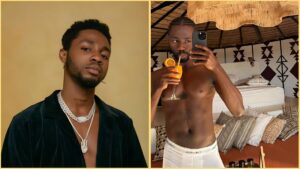 Side-by-side photos of Nigerian singer Omah Lay. The first shows him wearing a black outfit with layered silver chains, looking into the camera against a plain background. The second shows him shirtless in a bedroom, wearing white Calvin Klein briefs and holding a glass of orange drink while taking a mirror selfie.