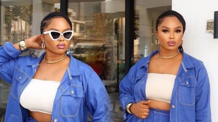 Side-by-side photo of BBNaija’s Onyeka wearing a blue denim two-piece outfit with a white tube top, gold accessories, and bold makeup; the left image shows her posing with white cat-eye sunglasses while the right image shows her looking straight ahead without the glasses.