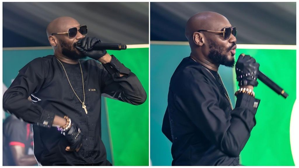 Split-image collage of Nigerian music legend 2Baba (2Face Idibia) performing on stage—left: front view holding a microphone close to his mouth, wearing dark sunglasses, black traditional outfit with subtle patterns, black gloves, gold chain necklace, and bracelets; right: side profile passionately singing into the microphone against a green backdrop.