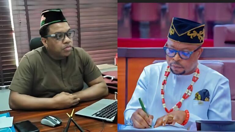 A split image showing two Akwa Ibom lawmakers. On the left, a man wearing glasses and a traditional cap sits at a desk with a laptop, appearing focused. On the right, another man in traditional attire and beaded necklace writes on a document inside a legislative chamber.
