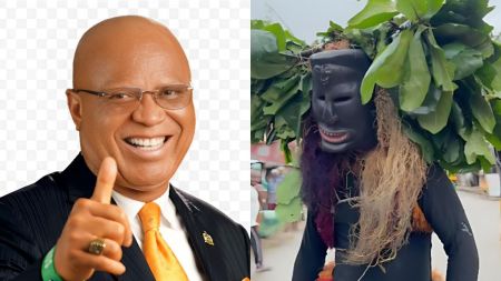 “Side-by-side image showing Akwa Ibom State Governor Umo Eno smiling and pointing forward, next to a traditional masquerade figure wearing a black mask, leafy headgear, and colourful raffia costume during a street outing.”