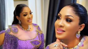 “Iyanaladuke poses indoors wearing a detailed purple beaded gown, styled with gold and purple jewellery, soft glam makeup, and a sleek ponytail, smiling in two close-up portrait shots.”