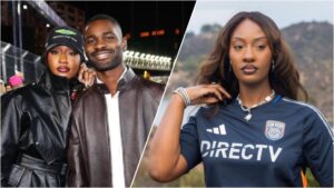 Nigerian singer Tems and British rapper Dave posing together on the red carpet at the 2025 Las Vegas Grand Prix Formula 1 event, smiling confidently side by side in formal attire against a nighttime backdrop of bright lights and race cars.