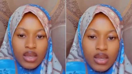 A Muslim woman wearing a patterned hijab speaks directly to the camera in a close-up selfie video.