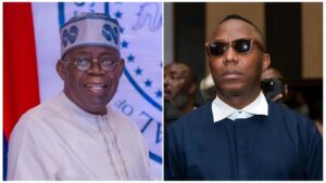 Split-image collage featuring (left) Nigerian President Bola Tinubu smiling in traditional white embroidered attire and a matching cap with blue patterns, against a backdrop with the Nigerian flag and partial text; (right) Nigerian activist and politician Omoyele Sowore in a dark blue traditional outfit with white collar and sunglasses, looking serious in an indoor setting with blurred people in the background.