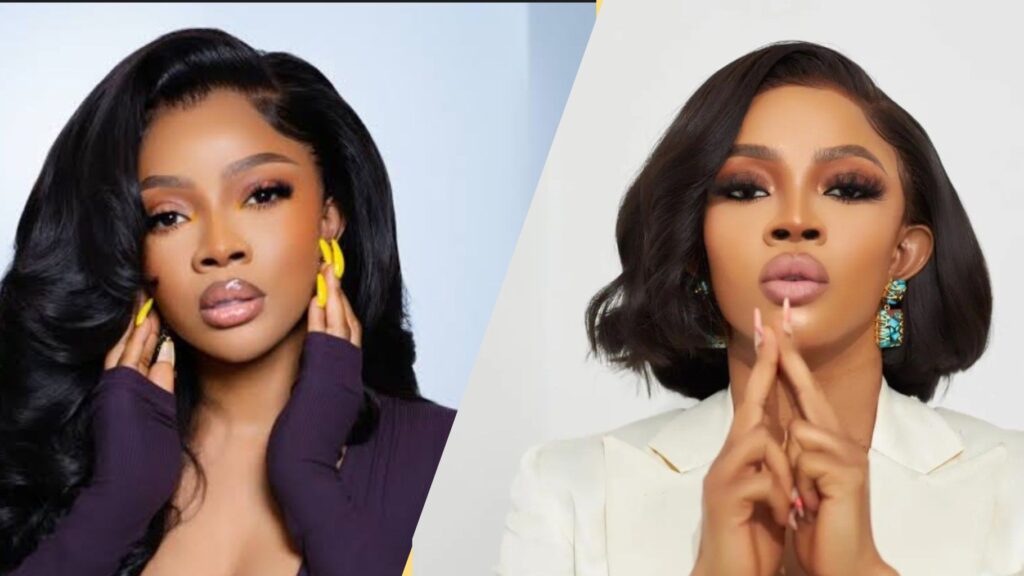 A side-by-side collage of Toke Makinwa. The left image shows her with long wavy black hair, yellow nails, and a purple top, posing with both hands near her face. The right image shows her with short styled black hair, turquoise earrings, and a white outfit, posing with her hands placed together near her chin.