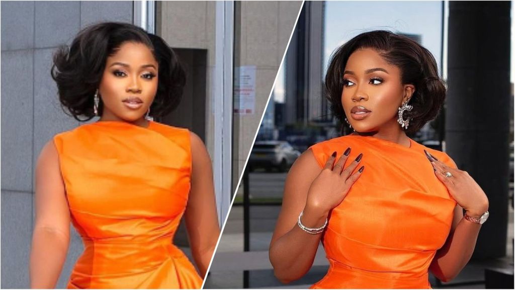 Veekee James poses outdoors in a bright orange fitted dress, wearing statement earrings and short styled hair in two side-by-side portrait shots.