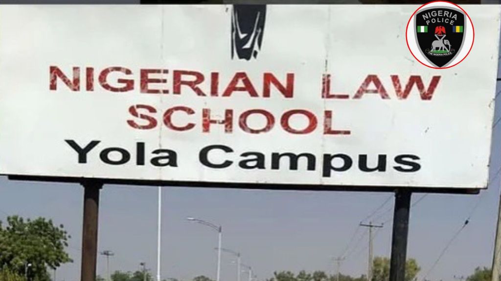 A large outdoor signboard displaying “Nigerian Law School Yola Campus” with a Nigeria Police logo placed in the top-right corner.