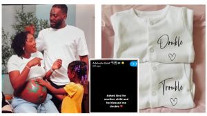 A collage image announcing the arrival of twins for Nigerian singers Adekunle Gold and Simi. The left side features a family photo of a pregnant Simi with green handprints on her baby bump, standing with Adekunle Gold and their daughter, Adejare. The right side displays two white baby onesies, one printed with "Double" and the other with "Trouble." A central overlay shows an Instagram Story from Adekunle Gold that reads, "Asked God for another child and he blessed me double."