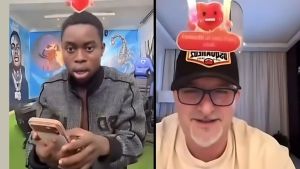 A split-screen screenshot of a live video call. On the left, Nigerian content creator Peller looks at his phone with a shocked expression and open mouth. On the right, Dubai-based businessman Samy Du smiles while wearing glasses and a black cap with a "DSQUARED2" patch.