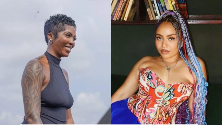 A split image featuring two female singers. On the left is Tiwa Savage, a Black woman with short, cropped dark hair, wearing a black sleeveless top. She is looking to her right and smiling, with a large tribal-style tattoo visible on her right arm. On the right is Moliy, a light-skinned Black woman with long, colorful braids in shades of blue and purple. She is wearing a vibrant, multi-colored patterned corset top and is looking directly at the camera with a neutral expression, posing in front of a bookshelf.