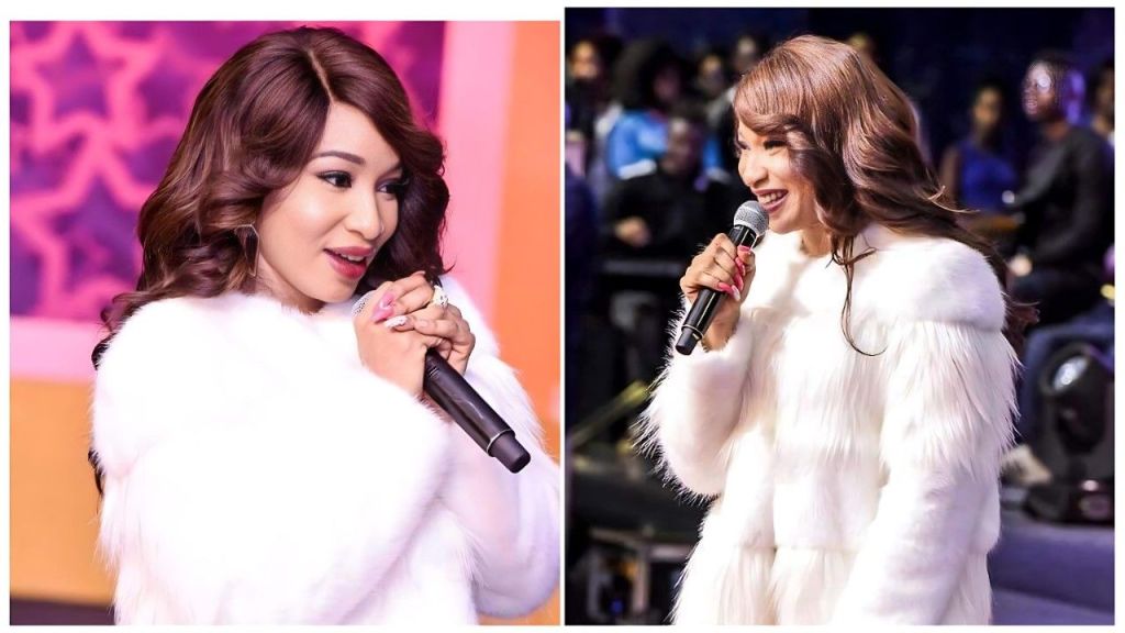 Tonto Dikeh ministering in a white fur coat during her testimony at Streams of Joy International Church.