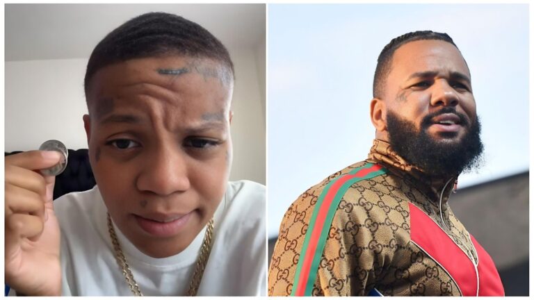 A split-screen image featuring Victoria Woods (also known as ScarFace Woodz) on the left and the rapper The Game on the right. Victoria Woods is seen in a close-up selfie-style shot, looking into the camera with a serious expression while holding a small coin between her fingers. On the right, The Game is pictured from a low angle, wearing a patterned Gucci tracksuit and looking off-camera with a contemplative expression.